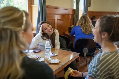 Two friends laughing and chatting